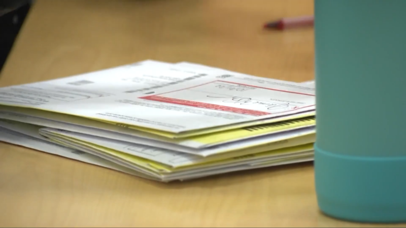 Stack of Various Forms and Documents on A Desk, Likely Used for Address Verification at Voting Polls in Ohio