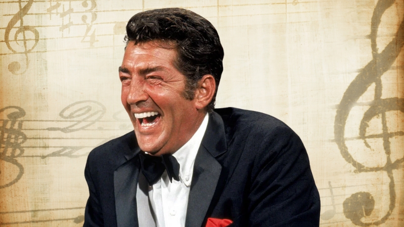 Dean Martin laughs in a tuxedo