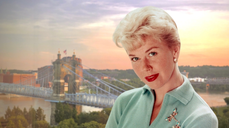 Doris Day poses with the Cincinnati skyline behind her