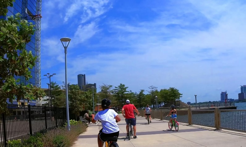 People riding bicycles at Detroit’s Riverwalk