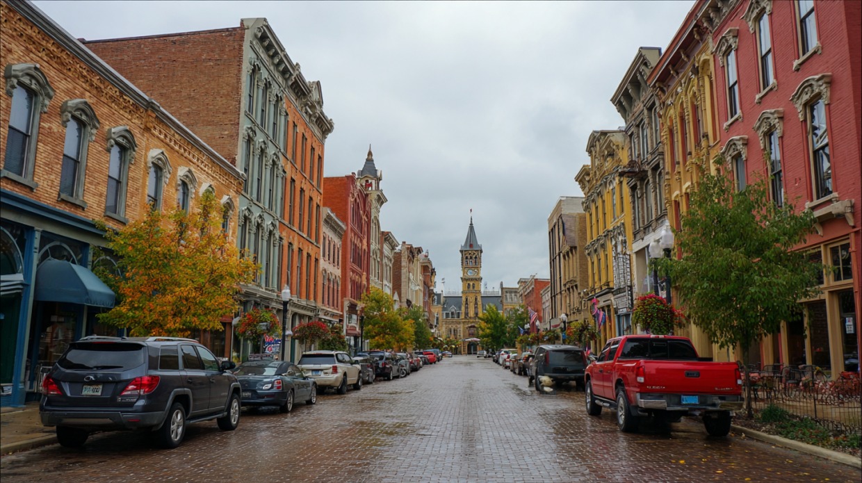 Street view of downtown Lima, Ohio lined with historic buildings